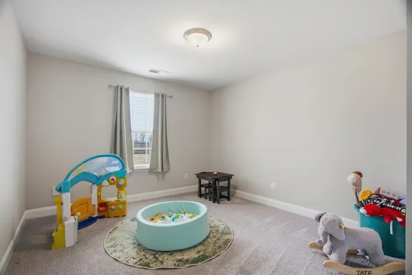 a room with a table and chairs