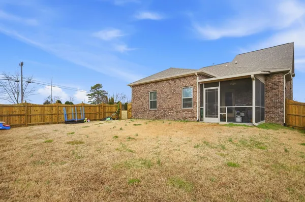 a view of swimming pool with a yard
