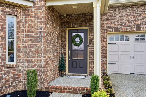 a view of front door of house with a street