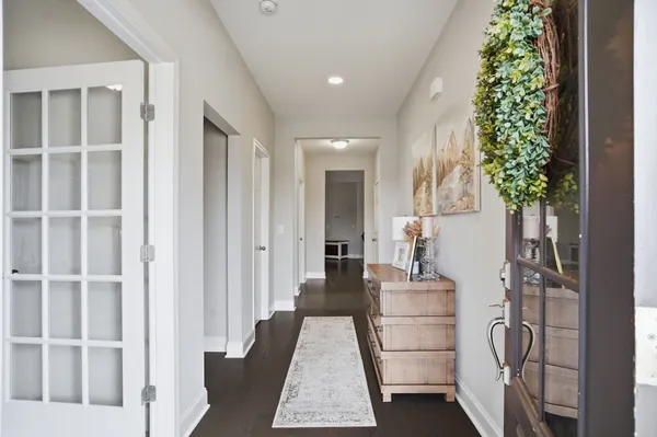 a hallway with a potted plant in front of it