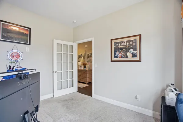 a view of a workspace with furniture and cabinet