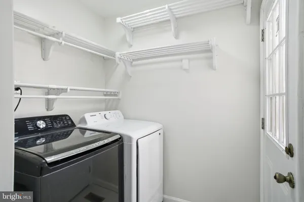 a utility room with dryer and washer