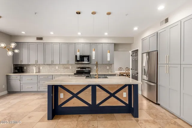 a kitchen with a refrigerator a white stove top oven a sink and a refrigerator