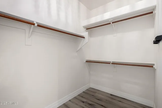 a view of an empty walk in closet