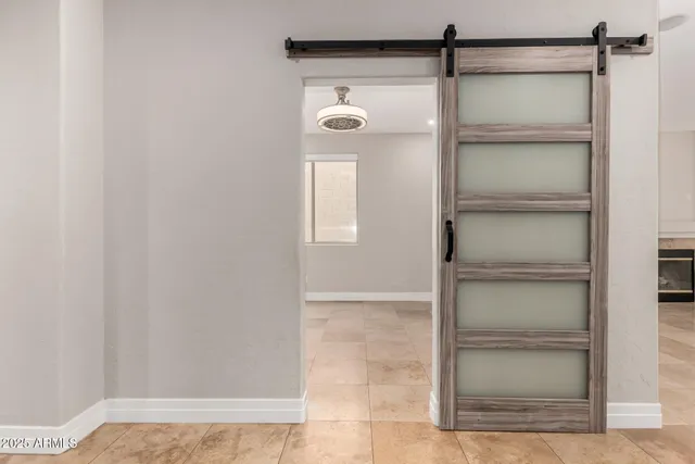 a bathroom with a glass shower door
