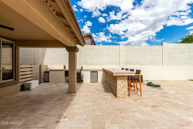 a view of a swimming pool with a patio