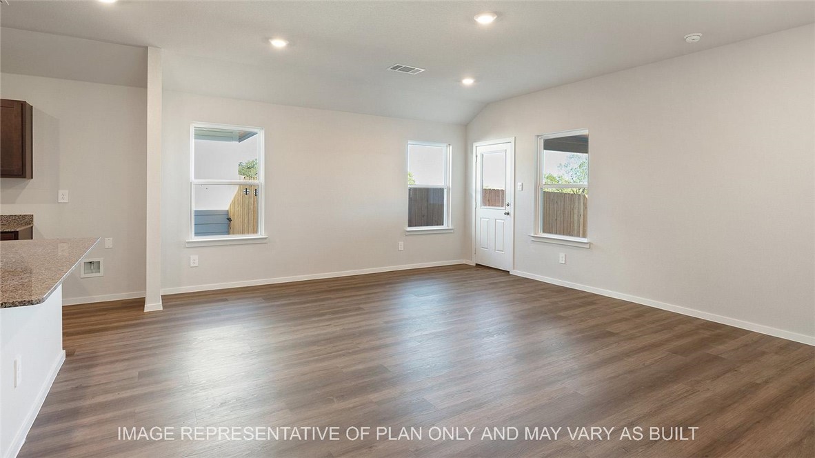 5416 Bear Run Bryan, TX 77807 - Photo 6 of 19 an empty room with wooden floor and windows