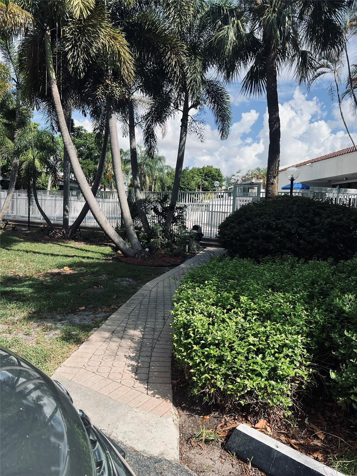 Undisclosed Address Lauderhill, FL 33319 - Photo 2 of 22 View of walkway to pool