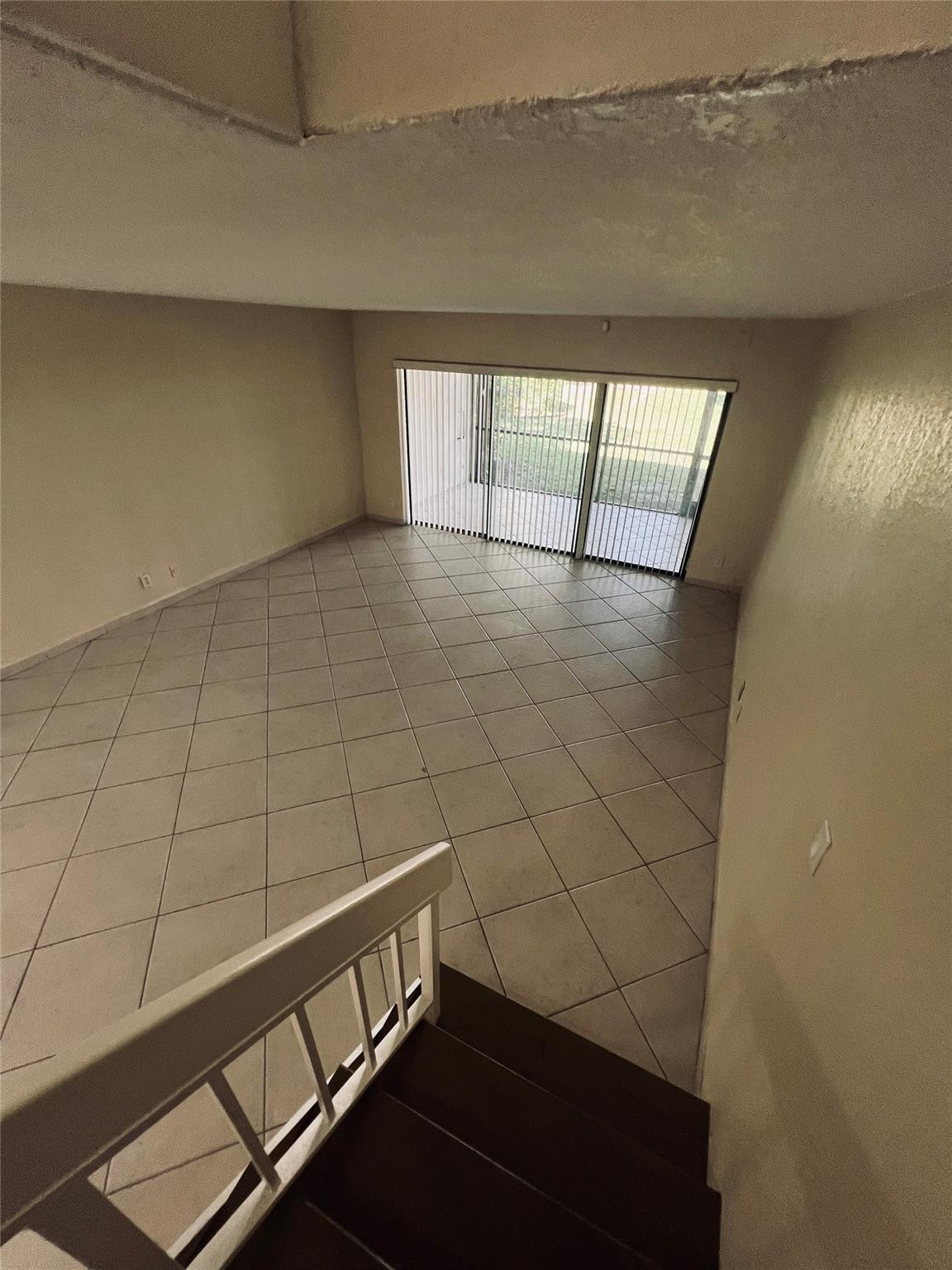 Undisclosed Address Lauderhill, FL 33319 - Photo 8 of 22 Living room from stairs