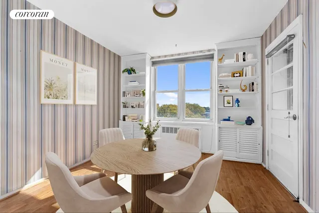 a kitchen with stainless steel appliances granite countertop a stove a sink dishwasher and cabinets with wooden floor