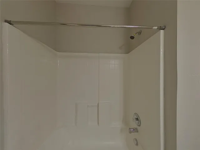 a view of hallway with seating space