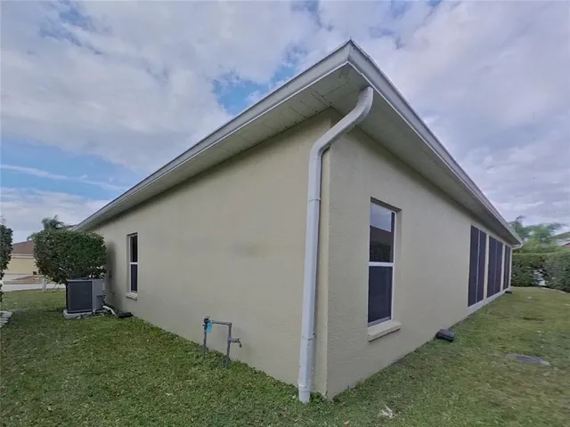 a backyard of a house with lots of green space