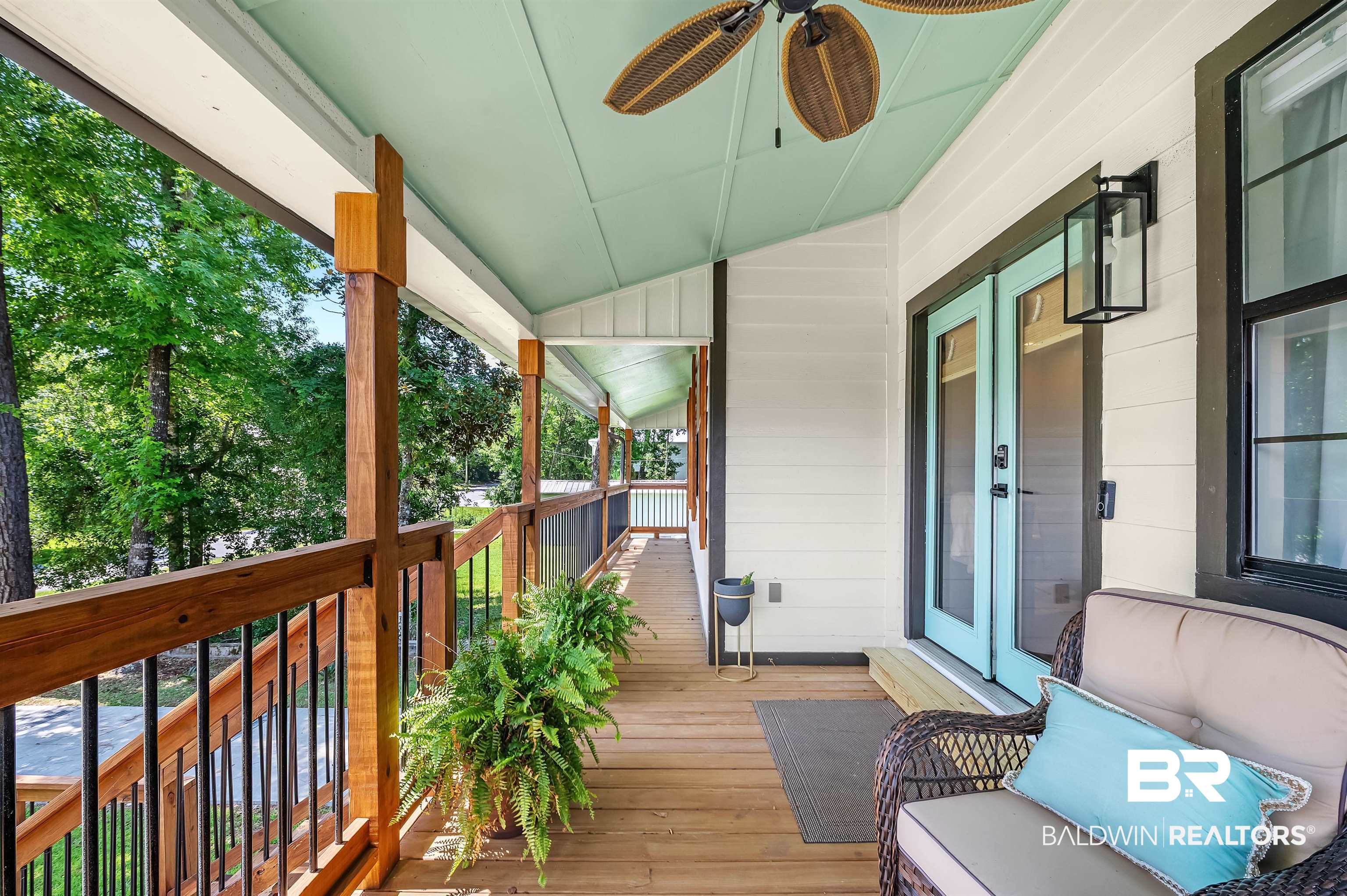 5215 Pine Road Orange Beach, AL 36561 - Photo 6 of 60 Wooden porch featuring a ceiling fan
