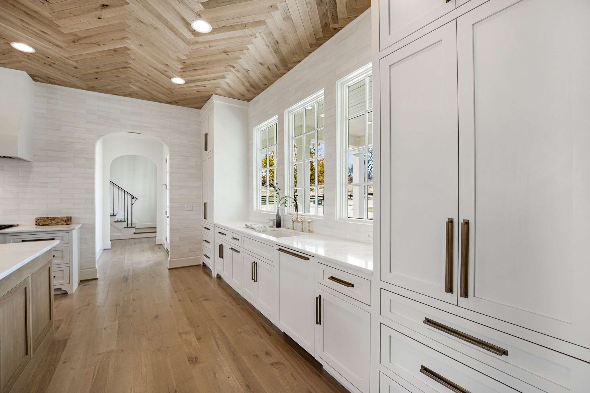 1995 Old Hillsboro Road Franklin, TN 37064 - Photo 25 of 70 a large white kitchen with granite countertop a large window and white stainless steel appliances