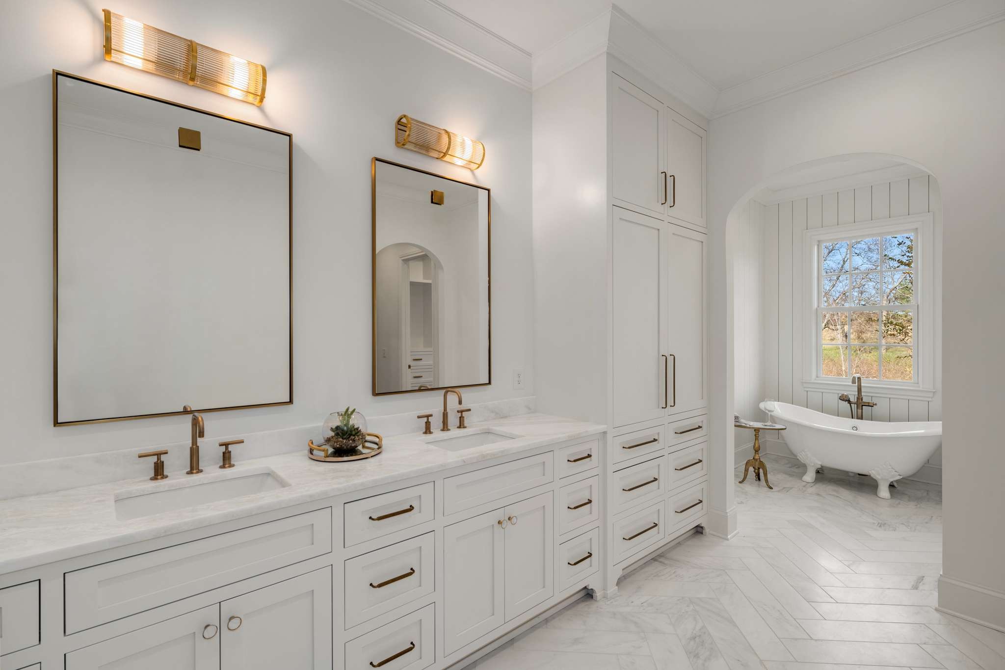 1995 Old Hillsboro Road Franklin, TN 37064 - Photo 34 of 70 a bathroom with double vanity sinks a large mirror and a bathtub