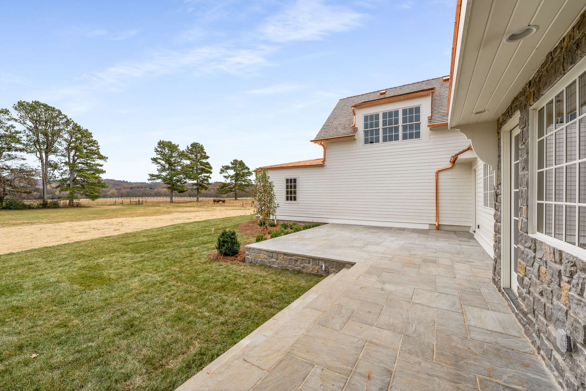 1995 Old Hillsboro Road Franklin, TN 37064 - Photo 55 of 70 a view of a big yard with an empty space and trees in the background