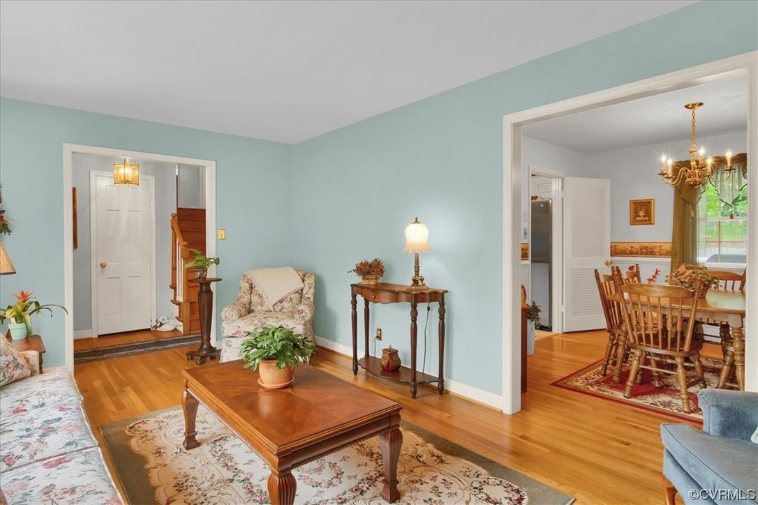 900 Ryder Road Richmond, VA 23235 - Photo 11 of 47 a living room with furniture a dining table and chairs with wooden floor