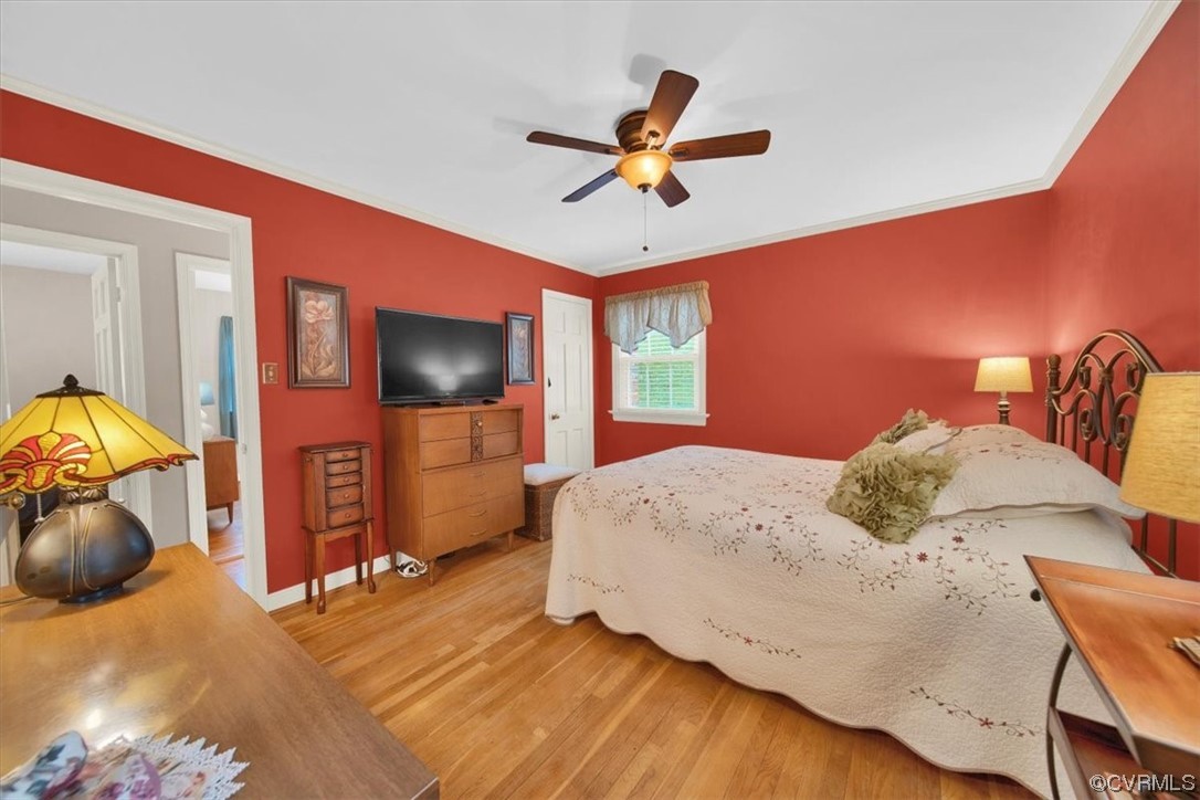 900 Ryder Road Richmond, VA 23235 - Photo 16 of 47 a bedroom with a bed and wooden floor