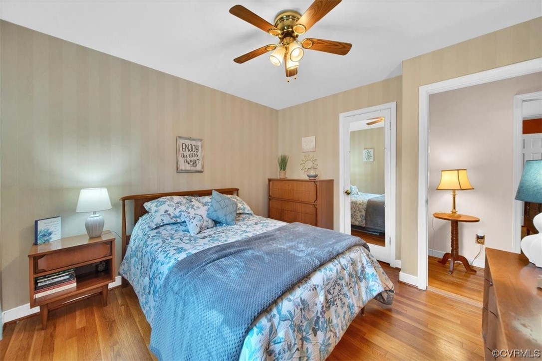 900 Ryder Road Richmond, VA 23235 - Photo 18 of 47 a bedroom with a bed and a chandelier