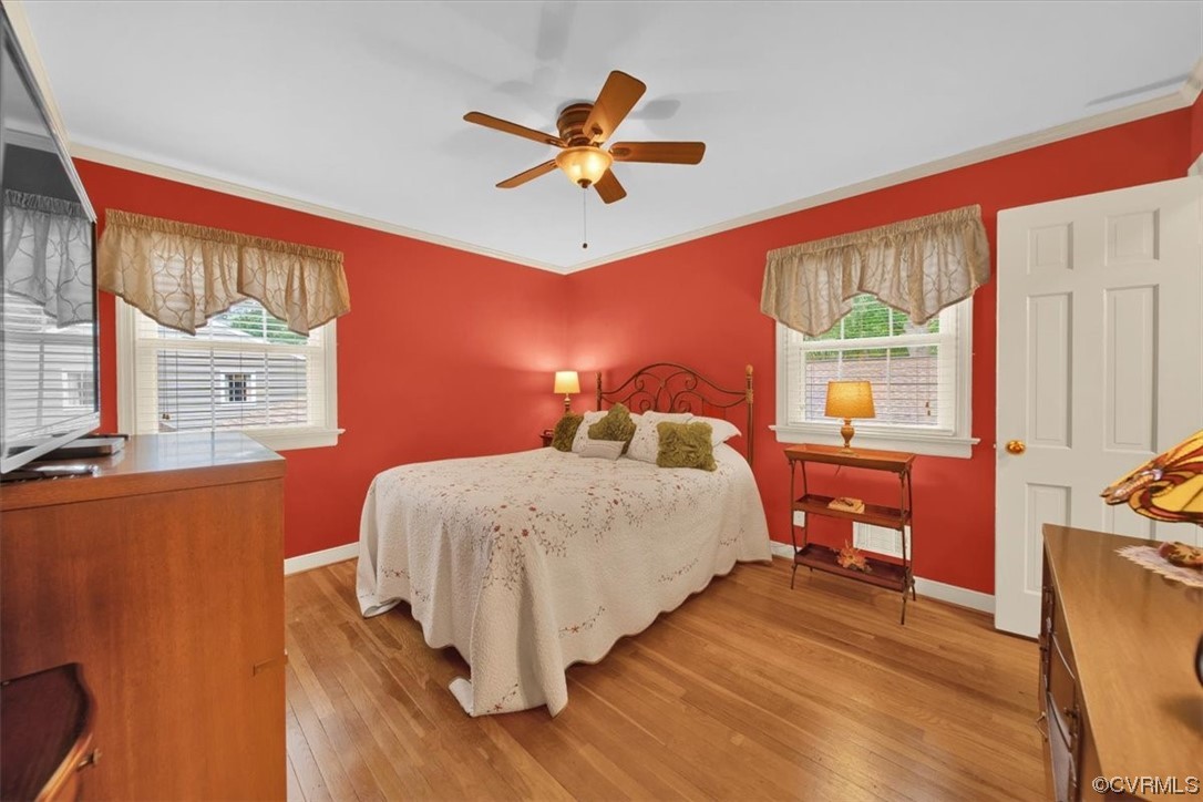900 Ryder Road Richmond, VA 23235 - Photo 19 of 47 a bedroom with a bed and wooden floor