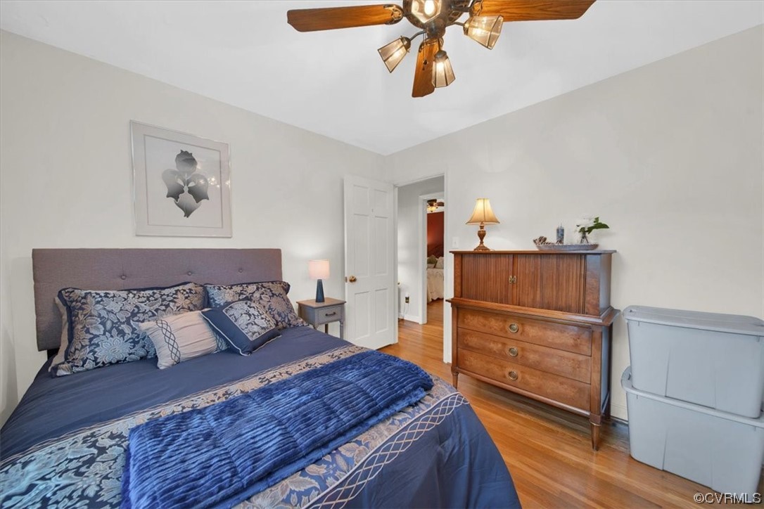 900 Ryder Road Richmond, VA 23235 - Photo 21 of 47 a bedroom with a bed and wooden floor