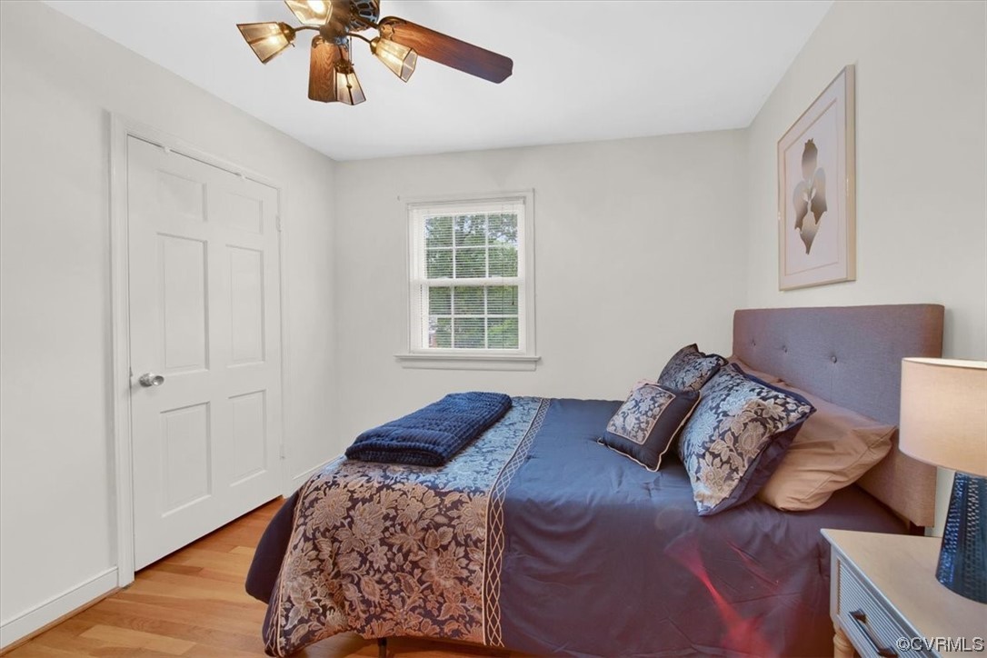 900 Ryder Road Richmond, VA 23235 - Photo 22 of 47 a bedroom with a bed and wooden floor