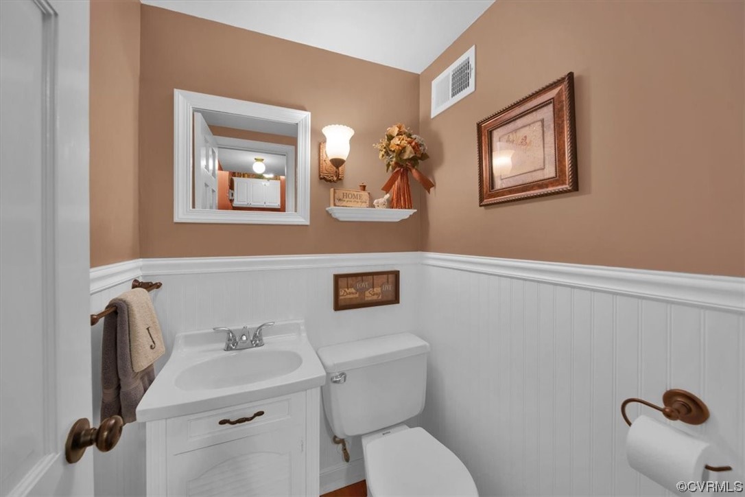 900 Ryder Road Richmond, VA 23235 - Photo 25 of 47 a bathroom with a toilet sink and mirror