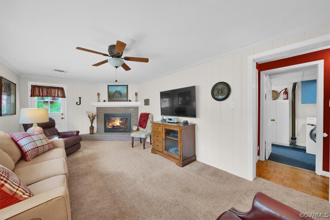 900 Ryder Road Richmond, VA 23235 - Photo 31 of 47 a living room with furniture a fireplace and a flat screen tv
