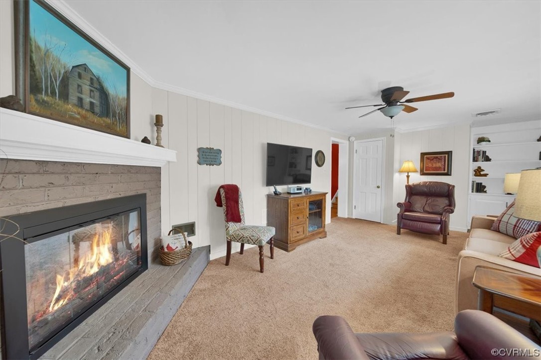 900 Ryder Road Richmond, VA 23235 - Photo 32 of 47 a living room with furniture a fireplace and a flat screen tv