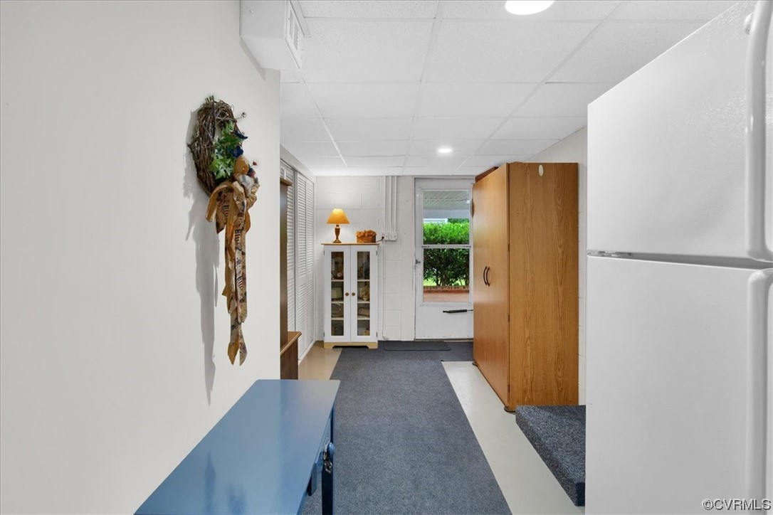 900 Ryder Road Richmond, VA 23235 - Photo 35 of 47 a view of a hallway with wooden floor and a refrigerator