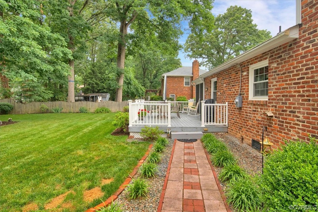 900 Ryder Road Richmond, VA 23235 - Photo 40 of 47 a front view of a house with a yard table and chairs