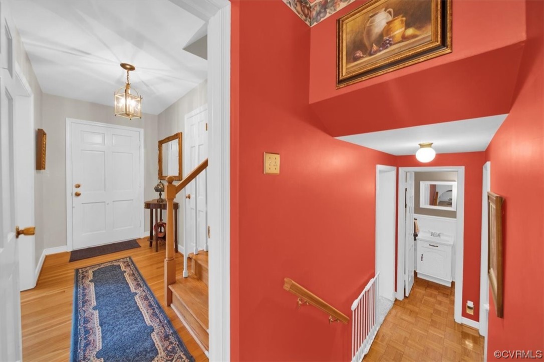 900 Ryder Road Richmond, VA 23235 - Photo 6 of 47 a view of a hallway with wooden floor and staircase