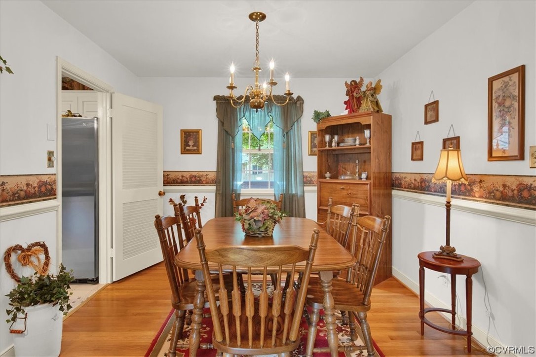 900 Ryder Road Richmond, VA 23235 - Photo 10 of 47 a view of a dining room with furniture window and wooden floor