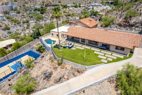 an aerial view of a house with a swimming pool