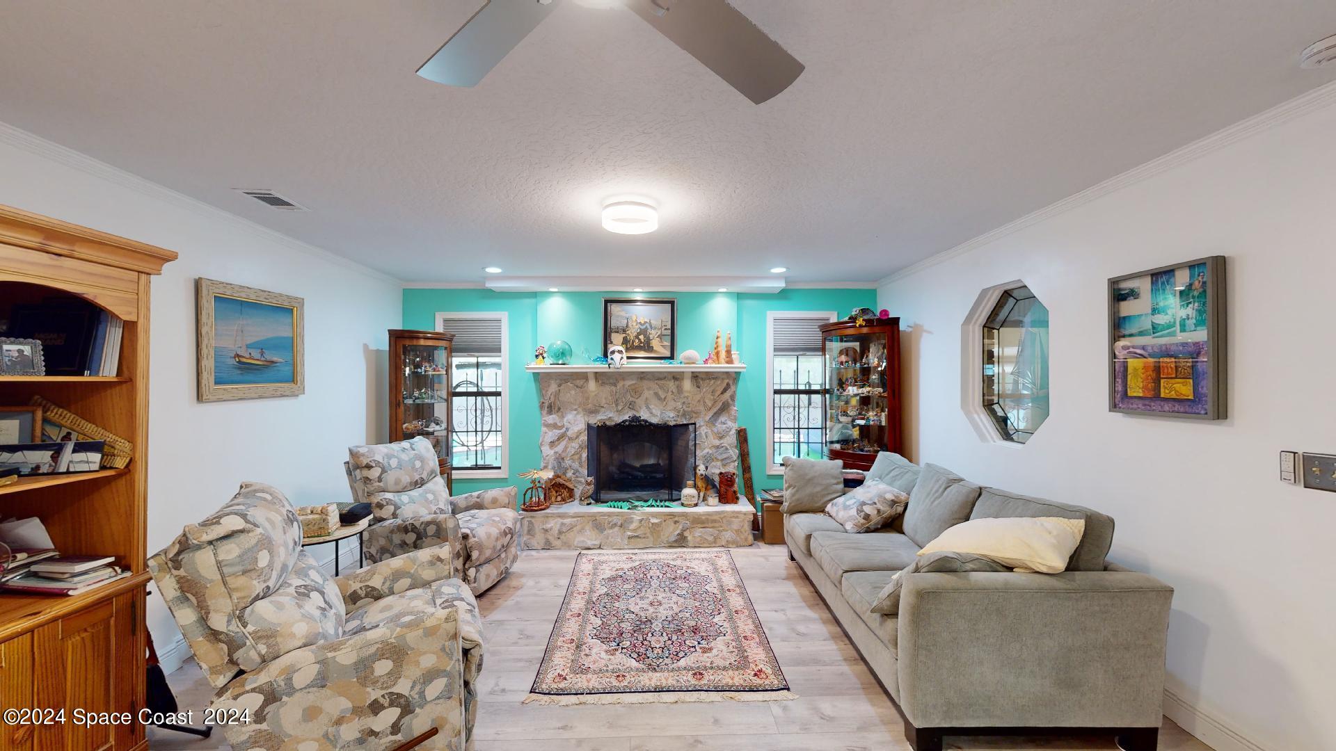 3020 Harlock Road Melbourne, FL 32934 - Photo 19 of 57 Living room fireplace