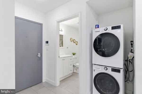 a view of a hallway with washer and dryer