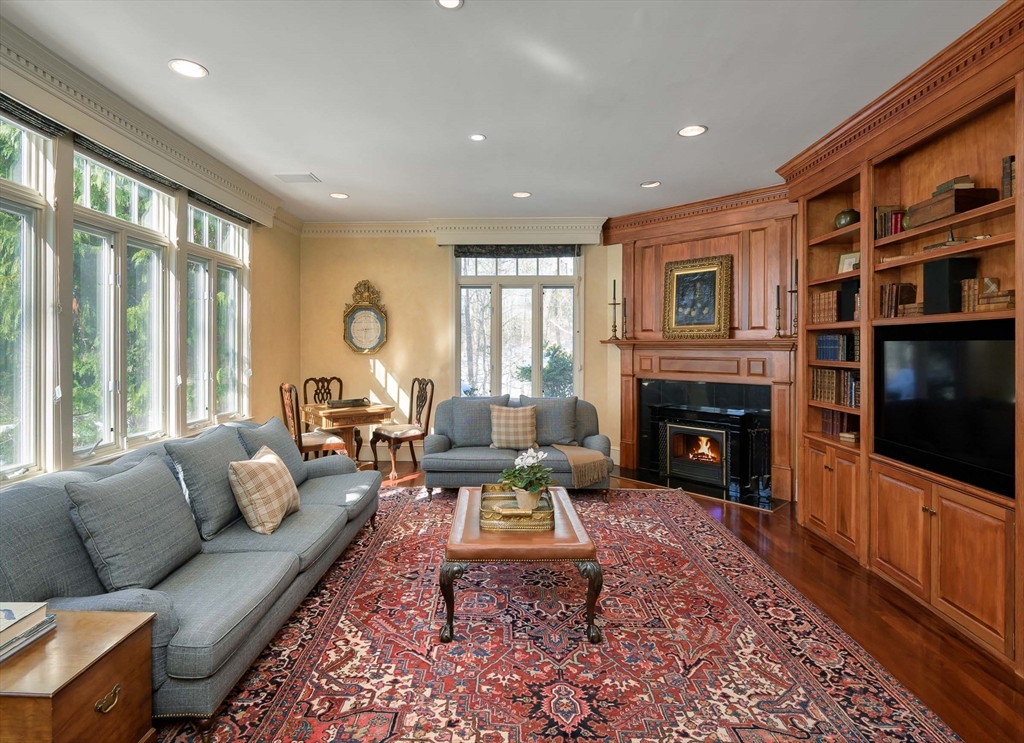 32 Sears Road Southborough, MA 01772 - Photo 16 of 41 a living room with furniture fireplace and flat screen tv