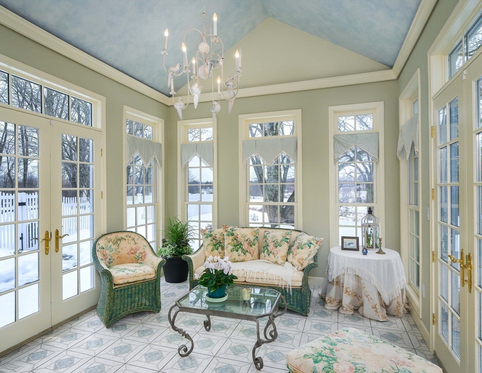 32 Sears Road Southborough, MA 01772 - Photo 18 of 41 a living room with furniture and a chandelier