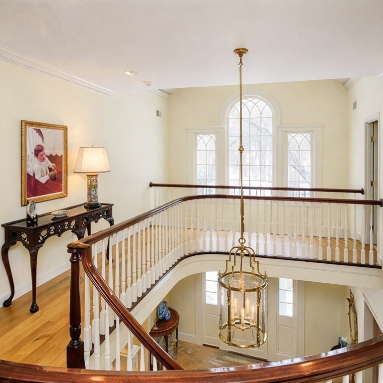 32 Sears Road Southborough, MA 01772 - Photo 21 of 41 a view of a hallway with a chandelier