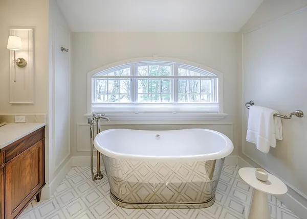 a bathroom with a toilet sink and shower