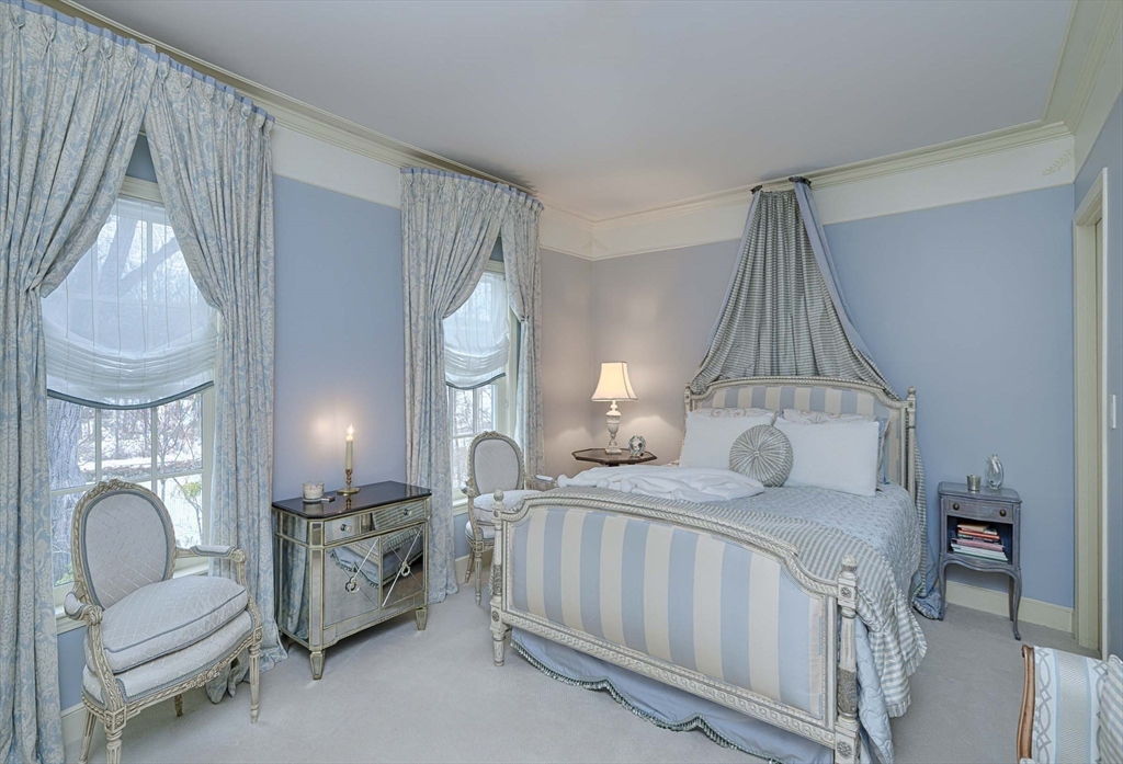 32 Sears Road Southborough, MA 01772 - Photo 27 of 41 a bedroom with furniture and a chandelier