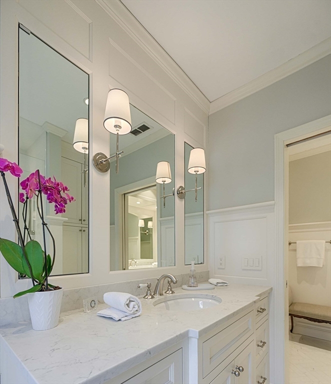 32 Sears Road Southborough, MA 01772 - Photo 30 of 41 a bathroom with a granite countertop sink a large mirror and a shower