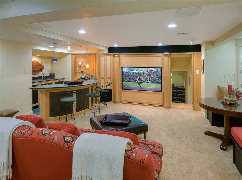 32 Sears Road Southborough, MA 01772 - Photo 38 of 41 a living room with furniture a floor to ceiling window and stainless steel appliances