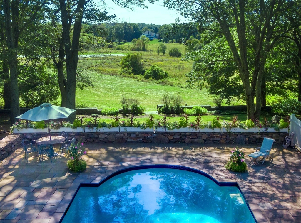 32 Sears Road Southborough, MA 01772 - Photo 5 of 41 a view of a backyard with plants and a garden