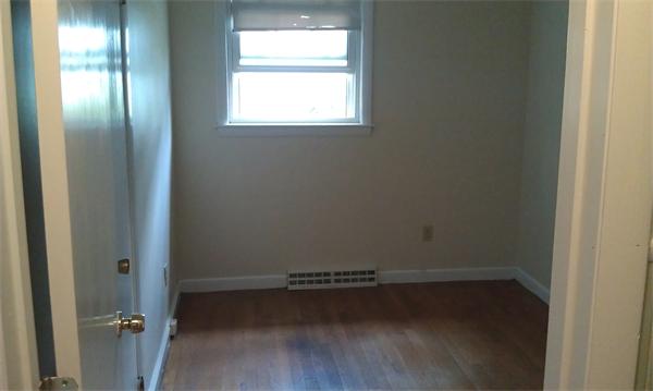 37 Dale Road Holbrook, MA 02343 - Photo 11 of 15 a view of an empty room with wooden floor and a window