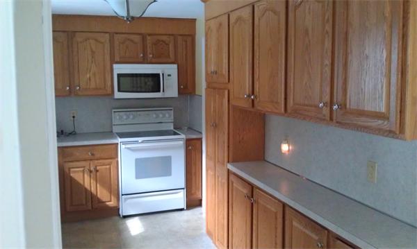 37 Dale Road Holbrook, MA 02343 - Photo 9 of 15 a kitchen with stainless steel appliances granite countertop a stove and a microwave with granite countertops