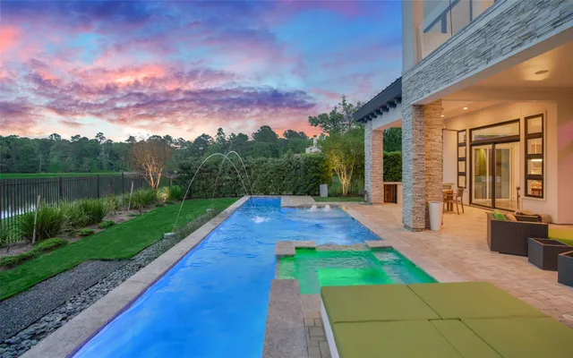 a view of a backyard with sitting area