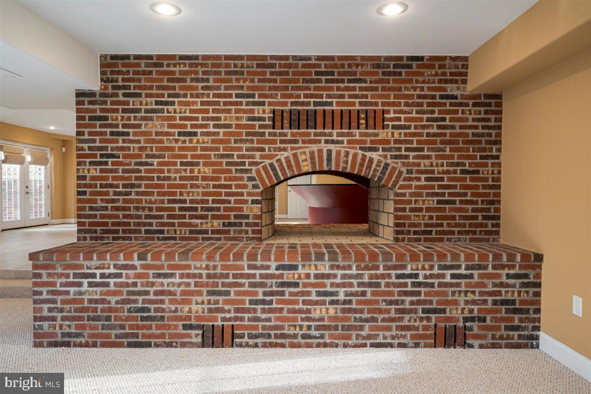 104 Farmgate Lane Silver Spring, MD 20905 - Photo 55 of 78 TWO- SIDED FIREPLACE IN BASEMENT