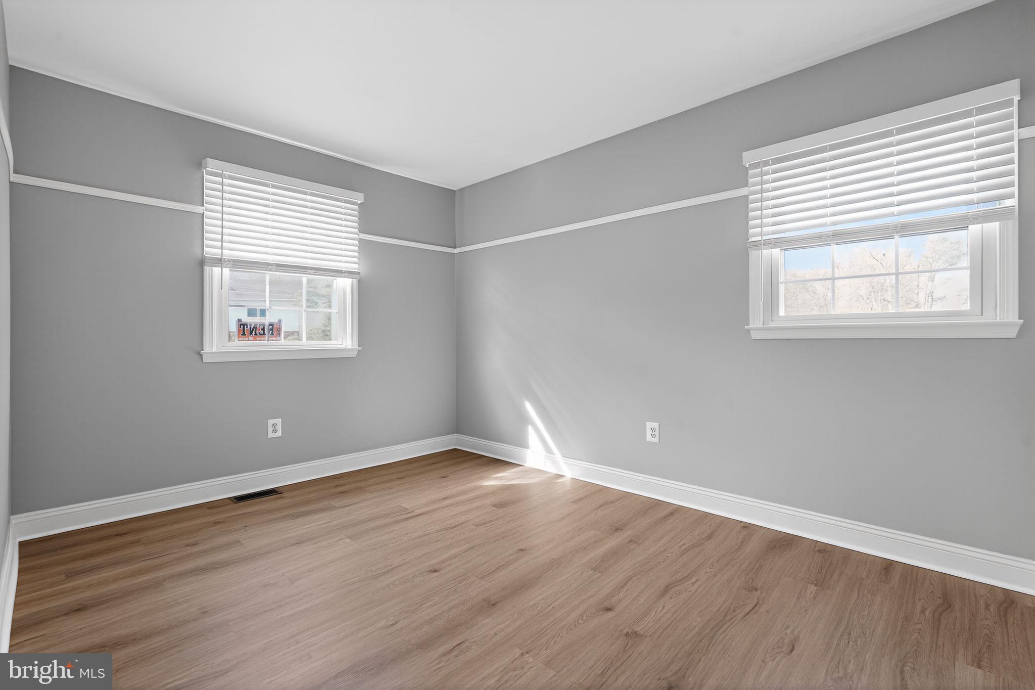 73 Greenvale Road Cherry Hill, NJ 08034 - Photo 13 of 23 a view of an empty room with wooden floor and a window
