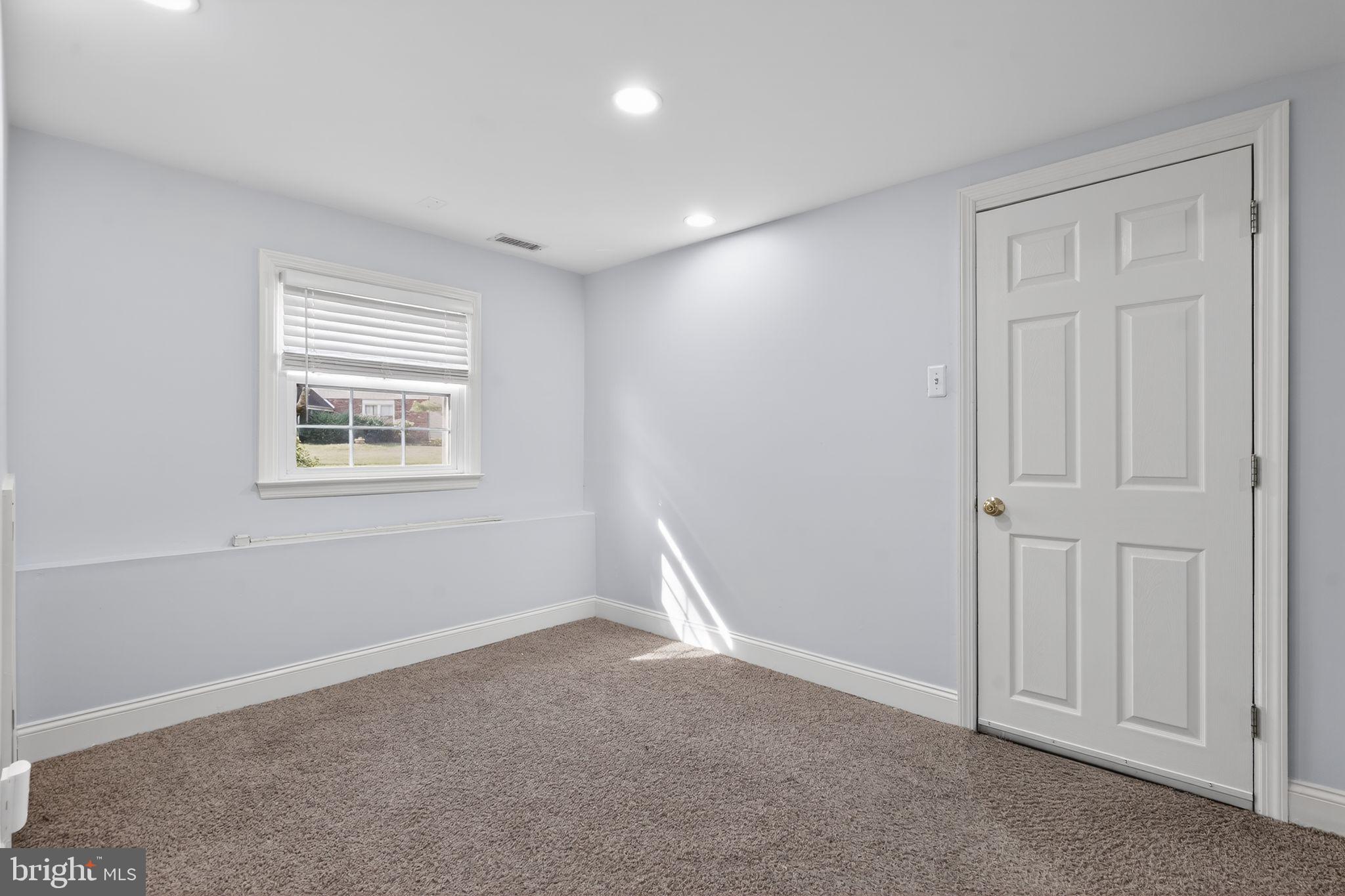 73 Greenvale Road Cherry Hill, NJ 08034 - Photo 17 of 23 an empty room with windows